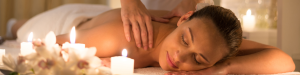 Woman receiving a massage in candlelight